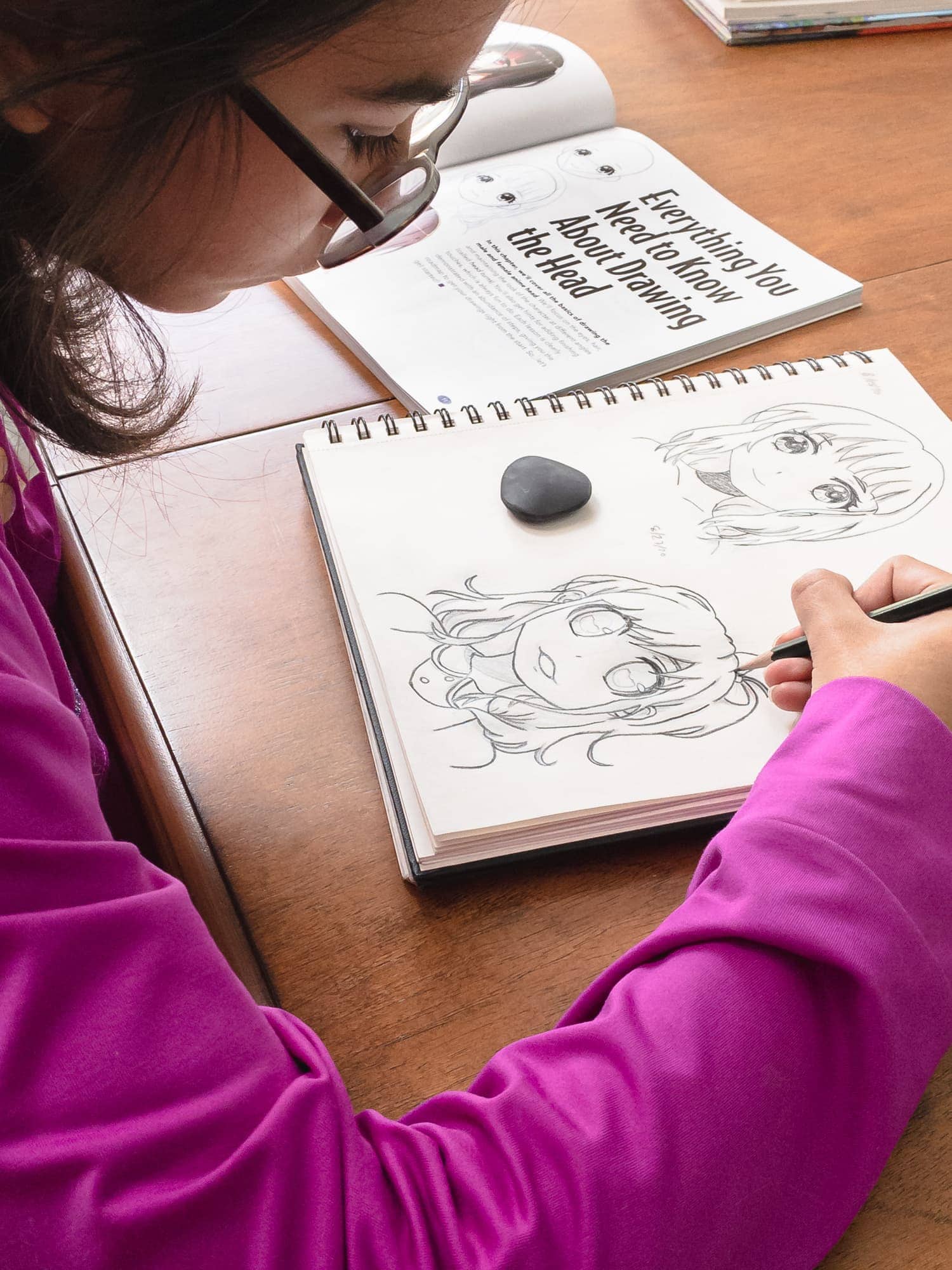 girl drawing anime as part of her homeschool art curriculum