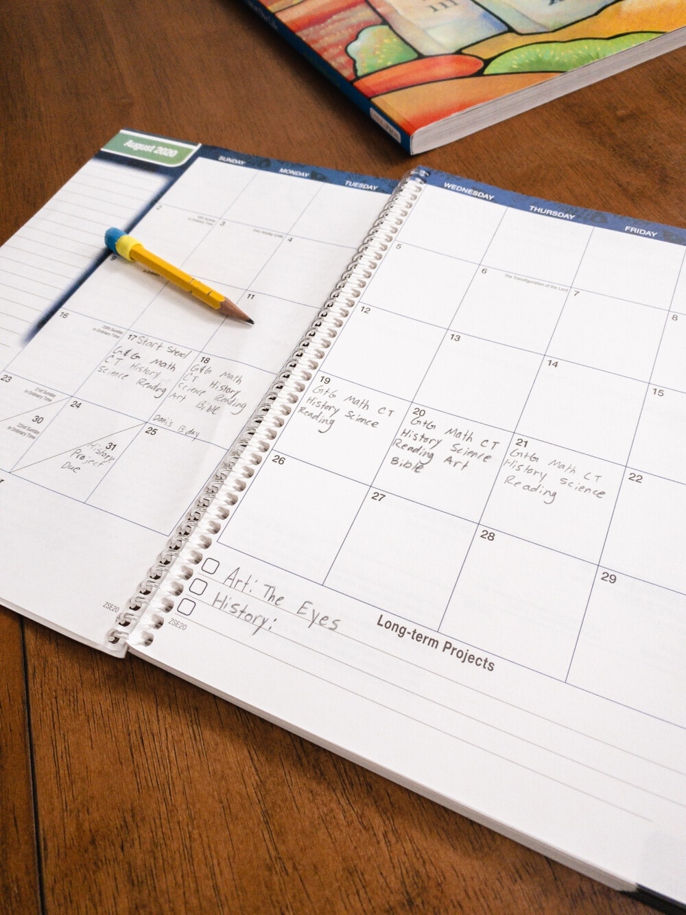 an open calendar planner opened up on a table