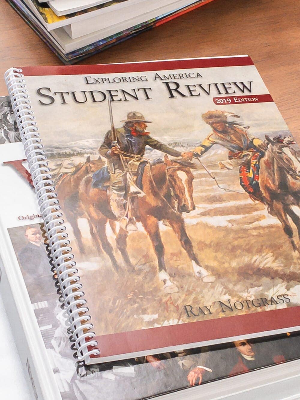 the notgrass exploring america student review book laying on a table