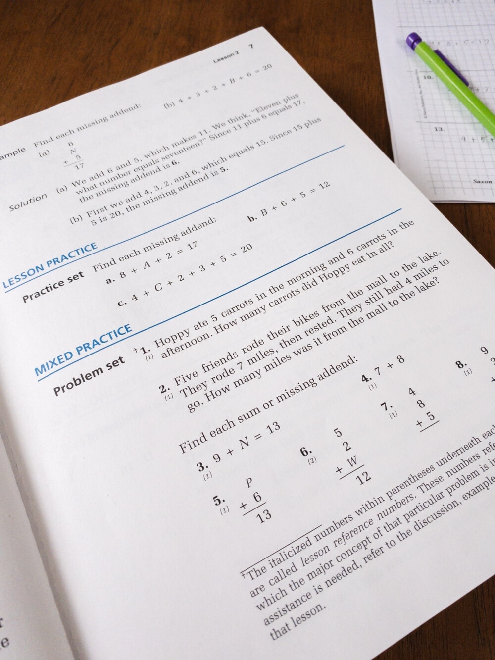 the saxon math 5/4 student workbook opened to a daily lesson practice and mixed practice page