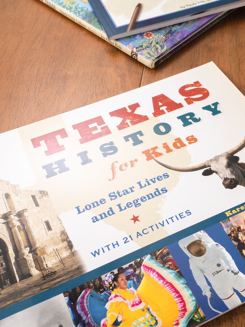 the book texas history for kids laying on a table