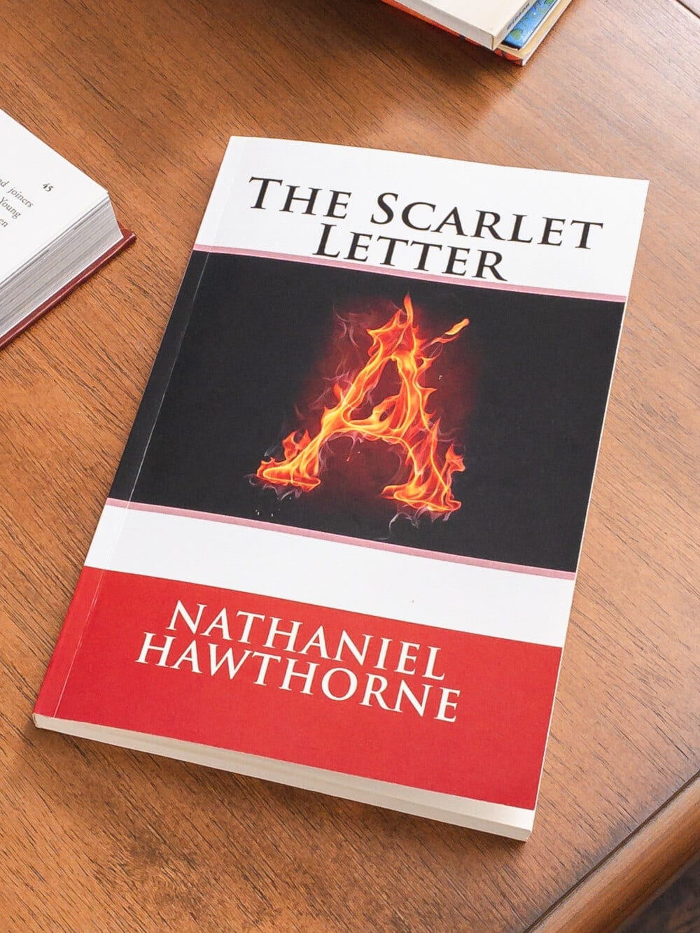 the book, the scarlet letter laying on a table