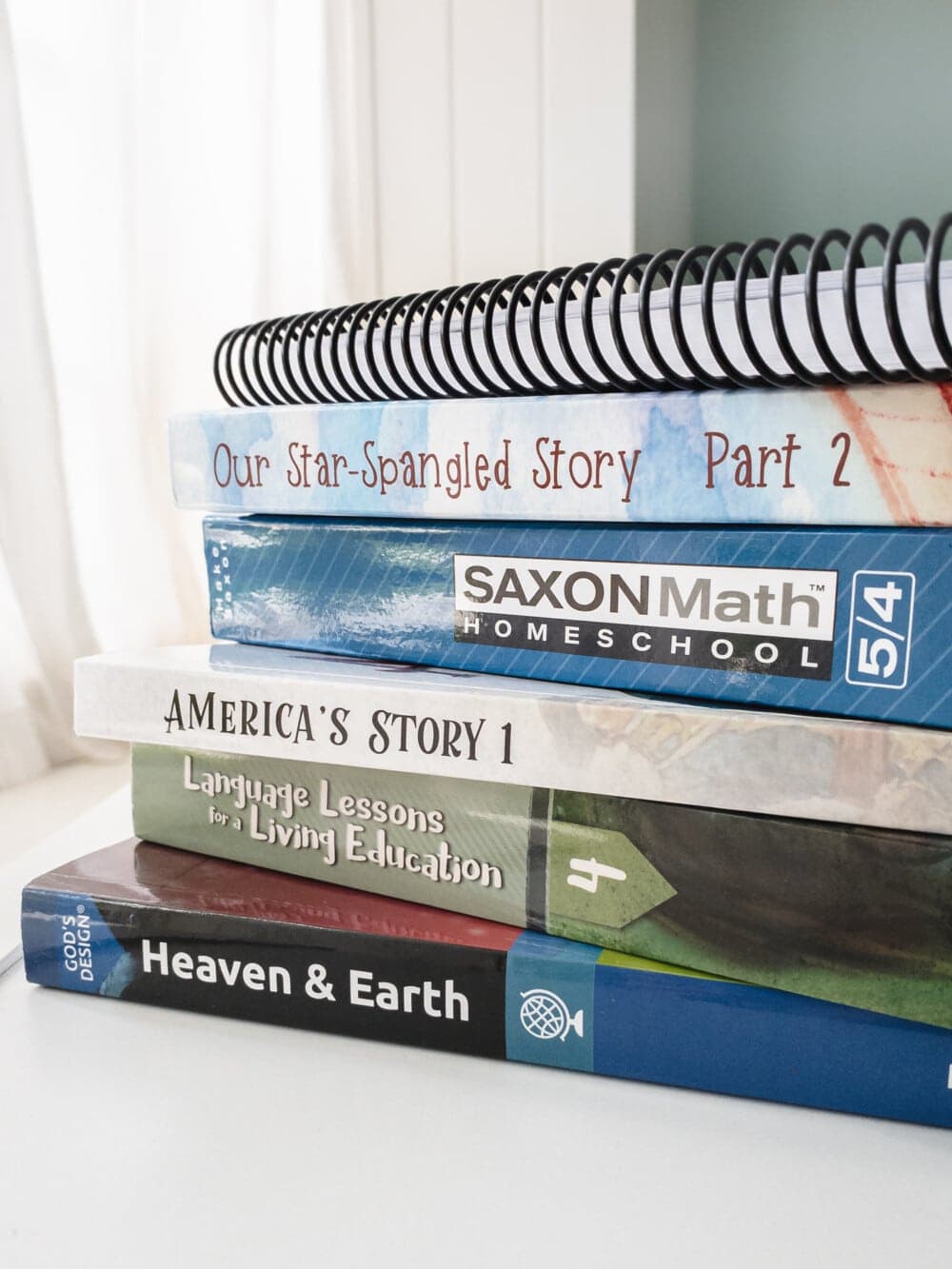 a stack of homeschool curriculum